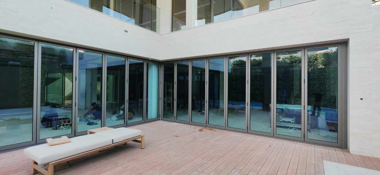 ALuK- BS70 series Bifold 1 -7 Panel, with various configiration 150KG, 24mm glass,  Anodized Finish, Sound & Thermal Insulation, Commercial & Residential Projects